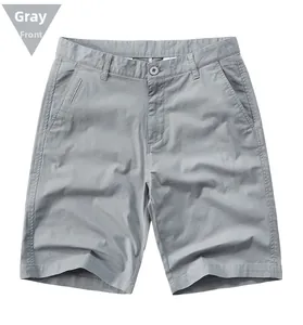 Detailed front view of grey cotton twill shorts with zip fly and side pockets