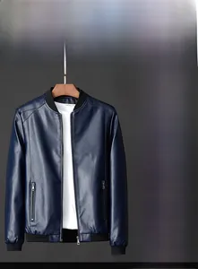 Detail of dark blue slim fit faux leather jacket featuring ribbed cuffs and stand collar