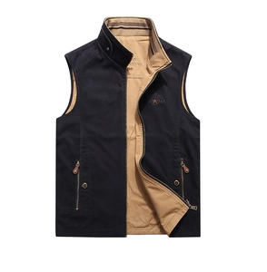 Detail of navy blue vest showing embroidered 1941 logo and metal zipper pockets