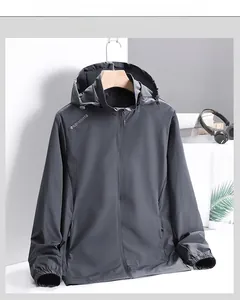 Detail view of grey hooded windbreaker with ELN SPORTS logo and elastic cuffs