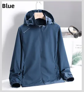 Detail of blue lightweight hooded sports jacket with front zipper and chest logo accent