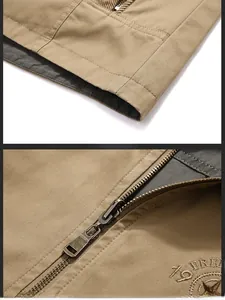 Macro detail of men's utility vest featuring heavy metal zipper and star embroidery