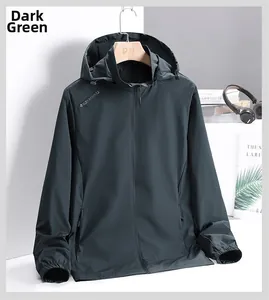 Detail view of water-resistant hood and elastic cuffs on dark green men jacket
