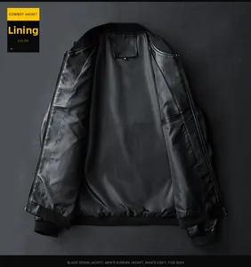 Detail view of the smooth black jacket inner lining with baseball collar and size tag