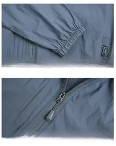 Détails des poignets élastiques et du zip sur une veste de protection solaire légère bleue