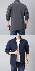 Close-up of windproof stand collar jacket showing smooth texture and elastic cuffs