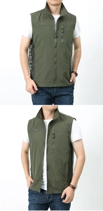 Détail macro du panneau en maille respirante et poche zippée sur gilet d'extérieur vert