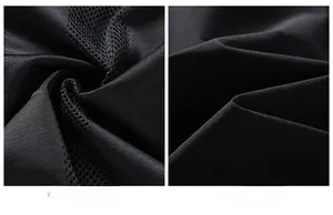 Detailed macro view showing the breathable mesh lining and smooth fabric of the black jacket