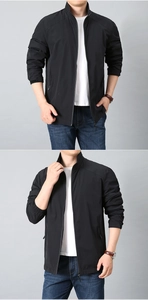 Close-up of black stand collar windbreaker jacket with zipper pockets and adjustable cuffs