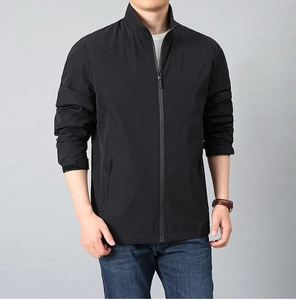 Detail of men's casual black jacket showing zip closure and adjustable velcro cuffs