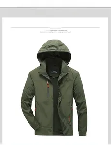 Detail view of army green hooded windbreaker jacket with black mesh lining and zip pockets