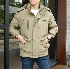 Detail of khaki men's winter parka with multi-pocket design and rough stock embroidery