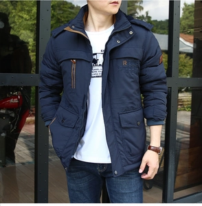 Detail view of navy blue warm men jacket featuring stand collar and chest embroidery