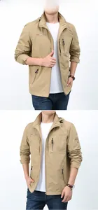 Detailed view of khaki hooded windbreaker with zip pockets and sleeve badge