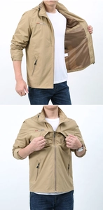 Detail of khaki outdoor jacket showing breathable mesh lining and zippered chest pocket