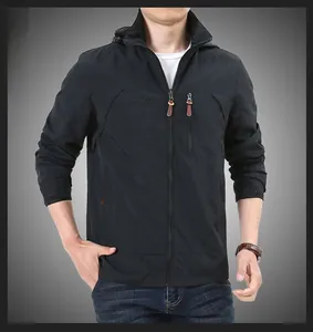 Detailed front view of men's waterproof outdoor jacket with hood and pockets in black