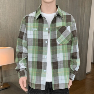 Detail of green plaid lamb wool jacket with chest embroidery and functional pocket