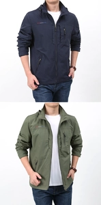 Detail view of navy and olive waterproof windbreakers with hood and zipper pockets