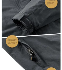 Détail de veste coupe-vent avec poignets velcro réglables et poche zippée métallique