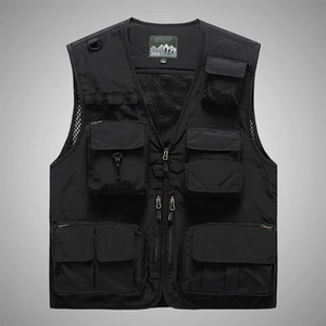 Close-up of black tactical vest V-neck with woven brand label and sizing detail