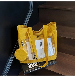 Detail of yellow tote bag with clear PVC window and matching circular coin purse