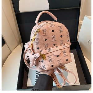 Pink mini backpack with teddy bear prints and charm in a premium gift box setup