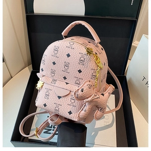 Detail of pink teddy bear mini backpack in lychee leather with gold zipper