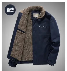 Detail of navy blue fleece-lined deck jacket with warm faux shearling lining and chest print
