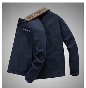 Close-up of navy blue sherpa collar jacket with P.L.A.N. letter print on the chest