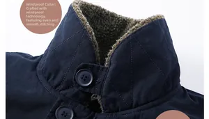 Detailed view of windproof collar with thick faux shearling lining and diamond quilting