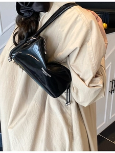 Chic black patent leather triangle pillow bag with silver metal ball accents for women