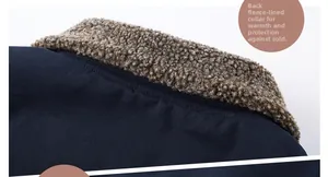 Macro detail of navy blue jacket with thick brown sherpa fleece lining for warmth