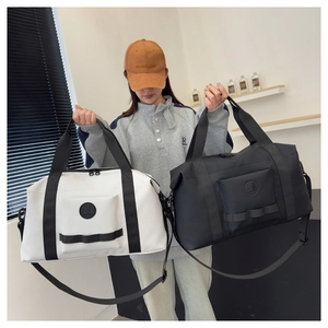 Detail view of high-capacity travel bags featuring waterproof nylon and reinforced straps