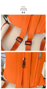 Detail of orange nylon backpack showing reinforced straps and waterproof zippers