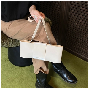 Detail of off-white rectangle shoulder bag with Fashion & Bags Leather lettering
