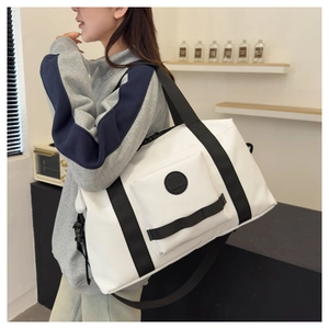 Detailed view of the large capacity travel bag on shoulder showing scale and design