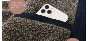 Close-up of the fleece jacket interior pocket showing large space for a smartphone