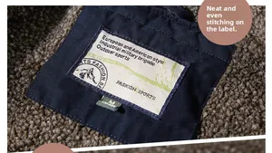 Detail of soft fleece lining and high quality woven neck label on retro deck jacket