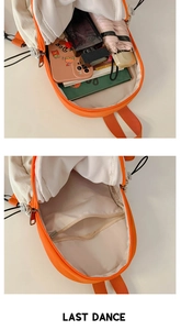 Detail view of the spacious inner main compartment and hidden zipper pocket in the backpack