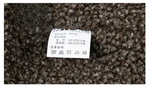 Detail view of the inner care label showing 100% cotton fabric on lamb fleece jacket