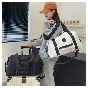 Travel bag back sleeve feature securely attached to a telescopic luggage handle