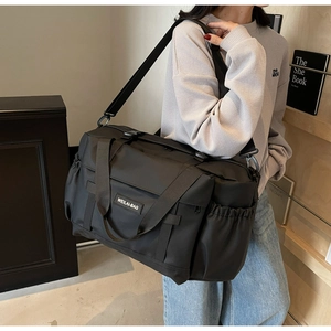 Sac de voyage noir grande capacité pour fitness et natation avec bandoulière réglable