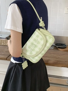 Light green checkered crossbody bag with cartoon print and cloud charm accessory
