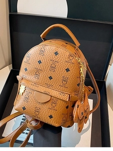 Brown leather mini backpack featuring teddy bear print and golden chain charm