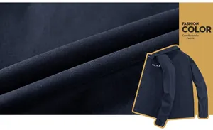 Detail of navy blue fleece jacket fabric with P.L.A.N. print and durable woven texture