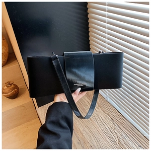 Minimalist black rectangle shoulder bag with fashion leather lettering and sleek strap