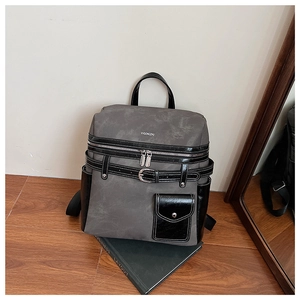 Detail showing retro industrial design with grey matte fabric and black patent leather trim