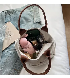 Detail view of spacious canvas tote bag interior showing large capacity storage with daily items