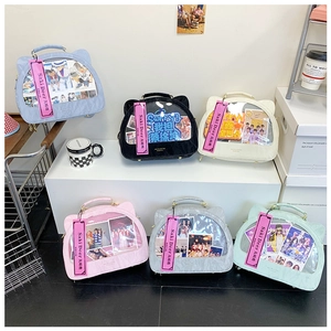 Collection of cat-ear ita bags in various colors with large clear display windows