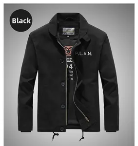 Detail of black military jacket featuring P.L.A.N. chest print and dual zipper button closure